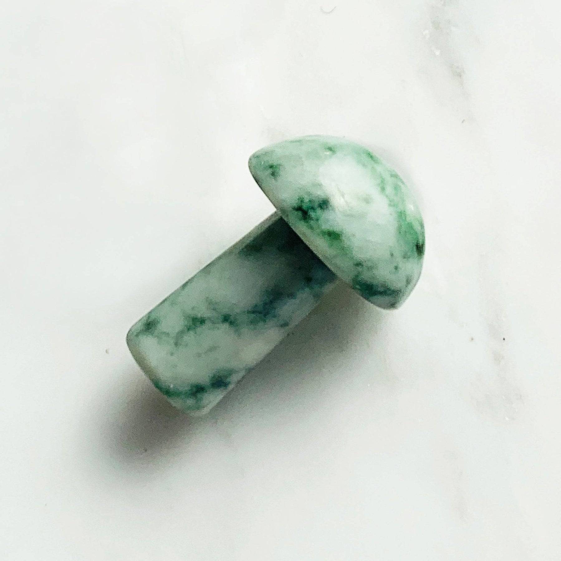 mini jade mushroom gua sha white background