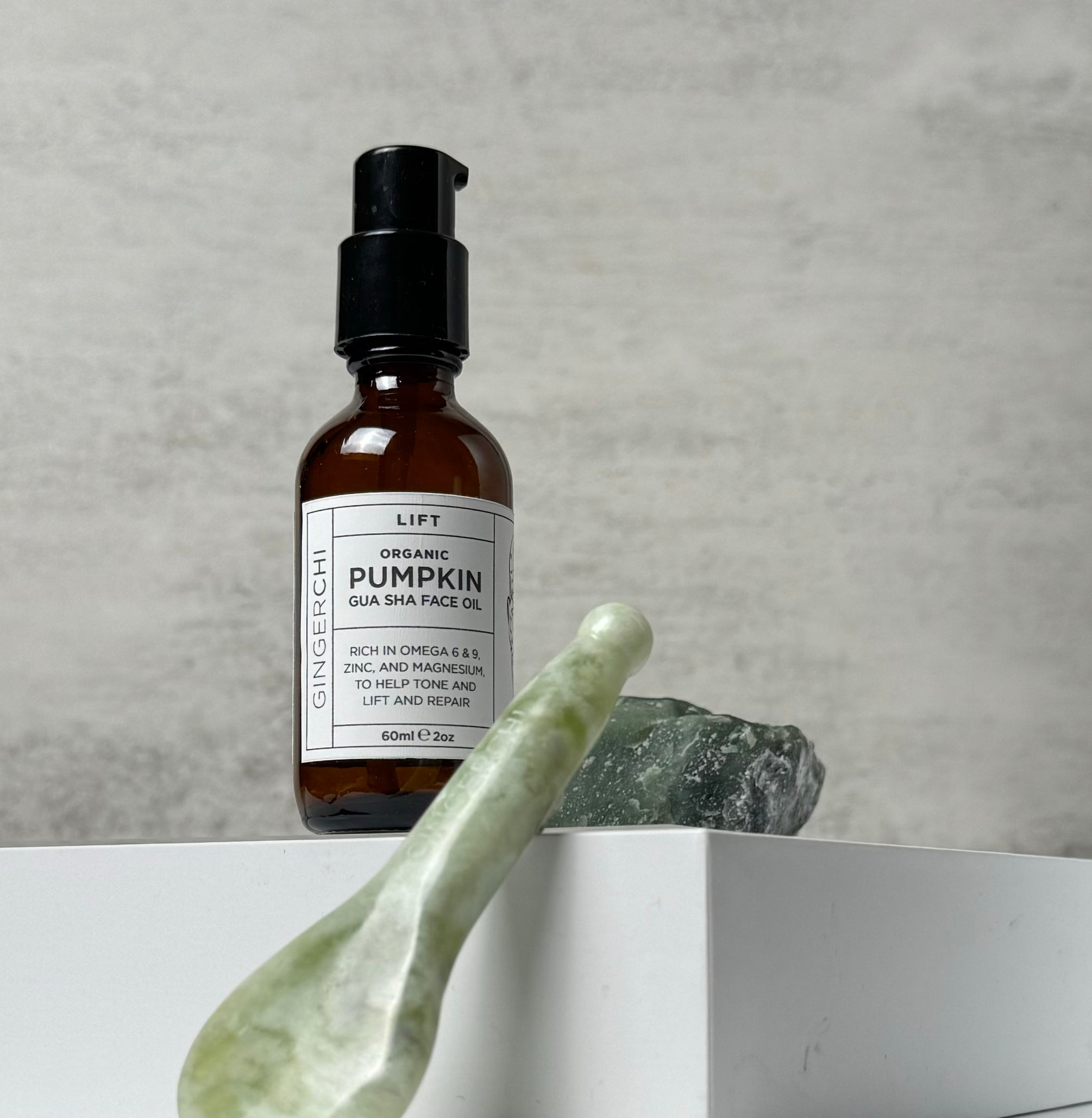 Organic Pumpkin Gua Sha Face Oil bottle with bojin spoon