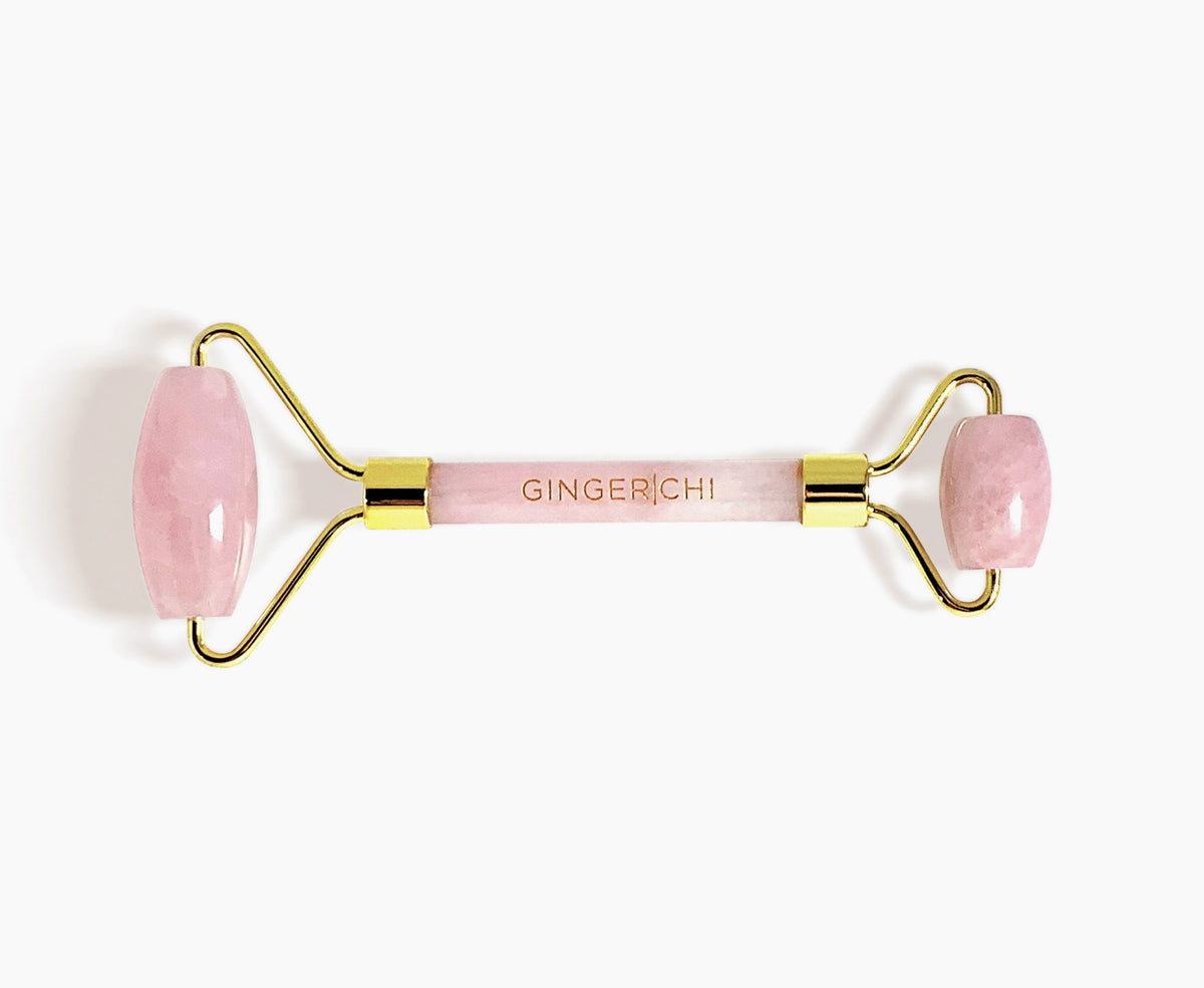 Pink rose quartz facial roller for skin care