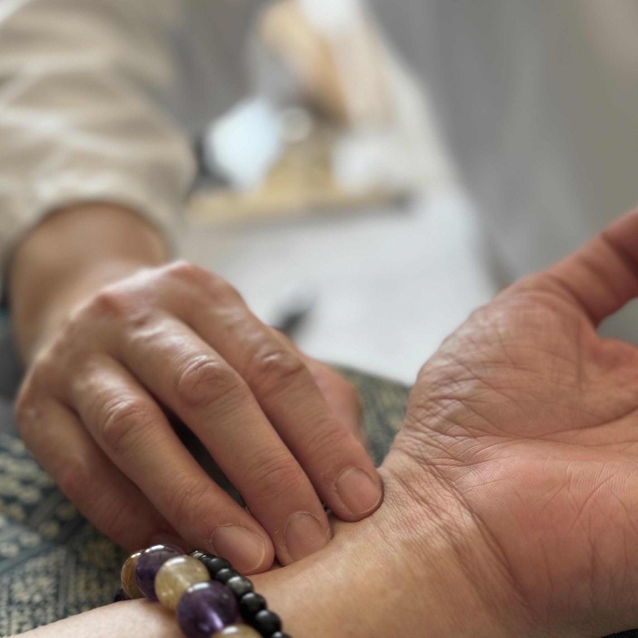 Hands with acupuncture needles